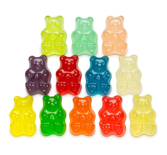 Assorted colorful gummy bear candies on a white background