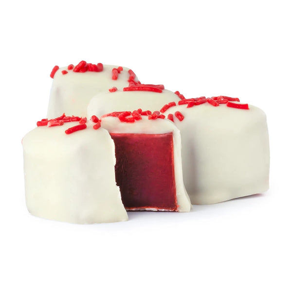 White chocolate truffles with red center on a white background