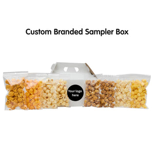Custom branded popcorn sampler box with a label for customization on a white background