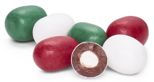 Six hard candy eggs in green, white, and red, with one egg broken open to show a chocolate-coated filling with white candy center, on a white background.