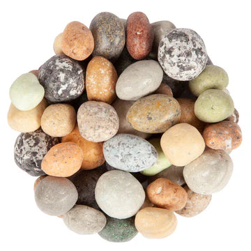 Assorted colored stones arranged in a circular pattern on a white background